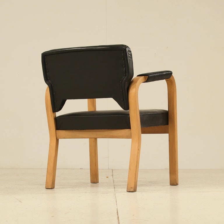 Armchair model #43 by Alvar Aalto with a bent laminated birch frame with black naugahyde upholstery. Upholstery is designed by Maija Heikinheimo.
This chair is in line with model E45 and 46 and was designed in various editions.
This chair is new old