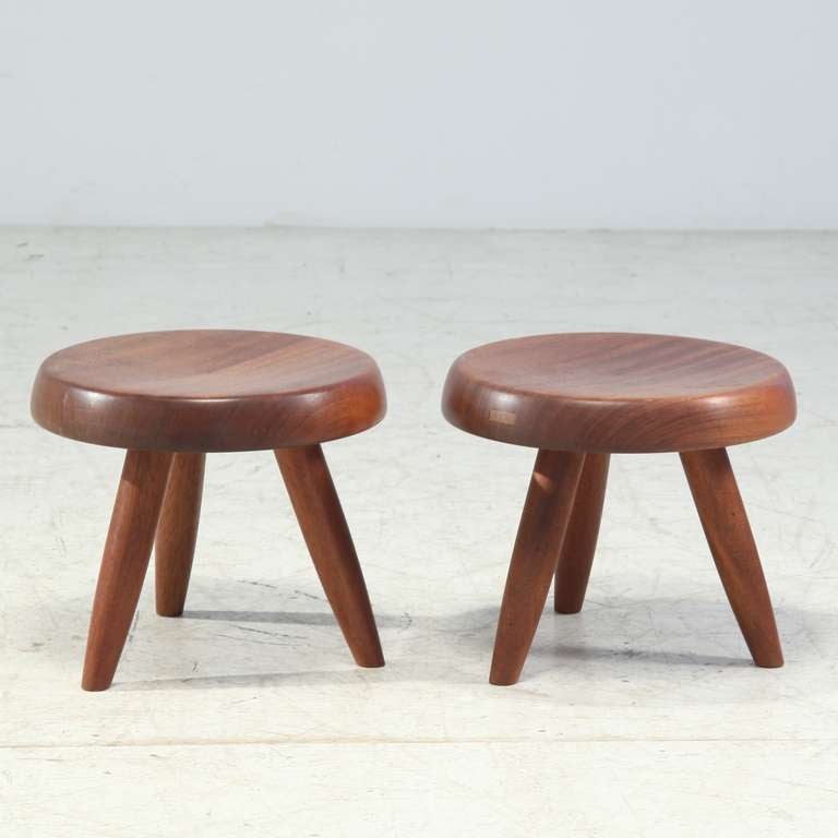 Pair of Charlotte Perriand low stools in mahogany. This stool was originally designed by Charlotte Perriand in the early 1950s and was used in projects like her own apartment in Paris. This piece is a Steph Simon edition from the 1960s.
Beautiful
