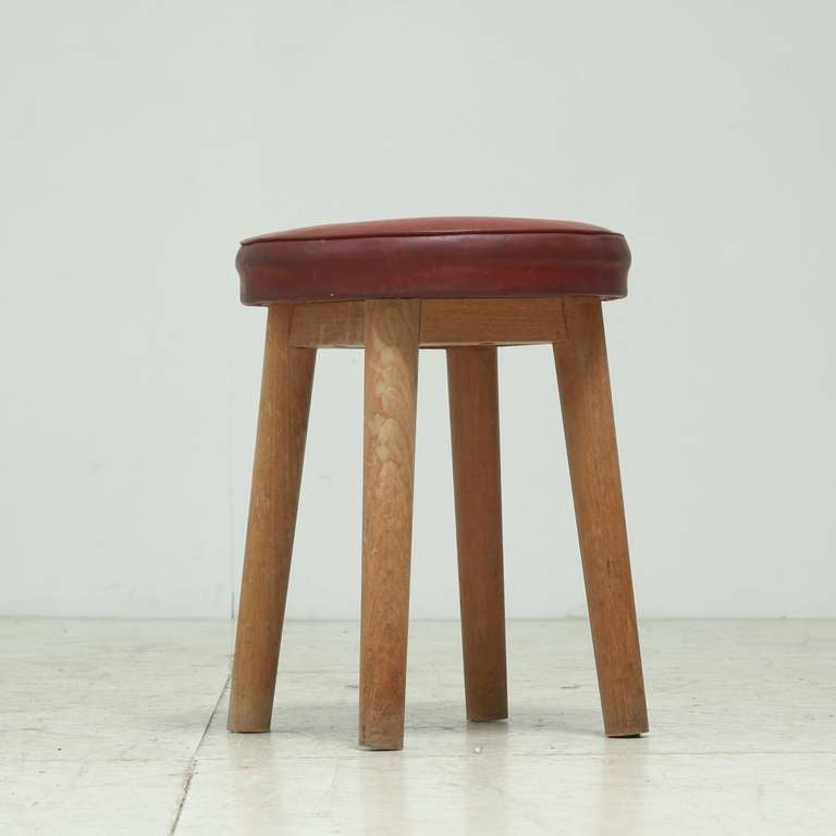 wooden four legged stool with naugahyde seat cover,
late 1940s/early 1950s