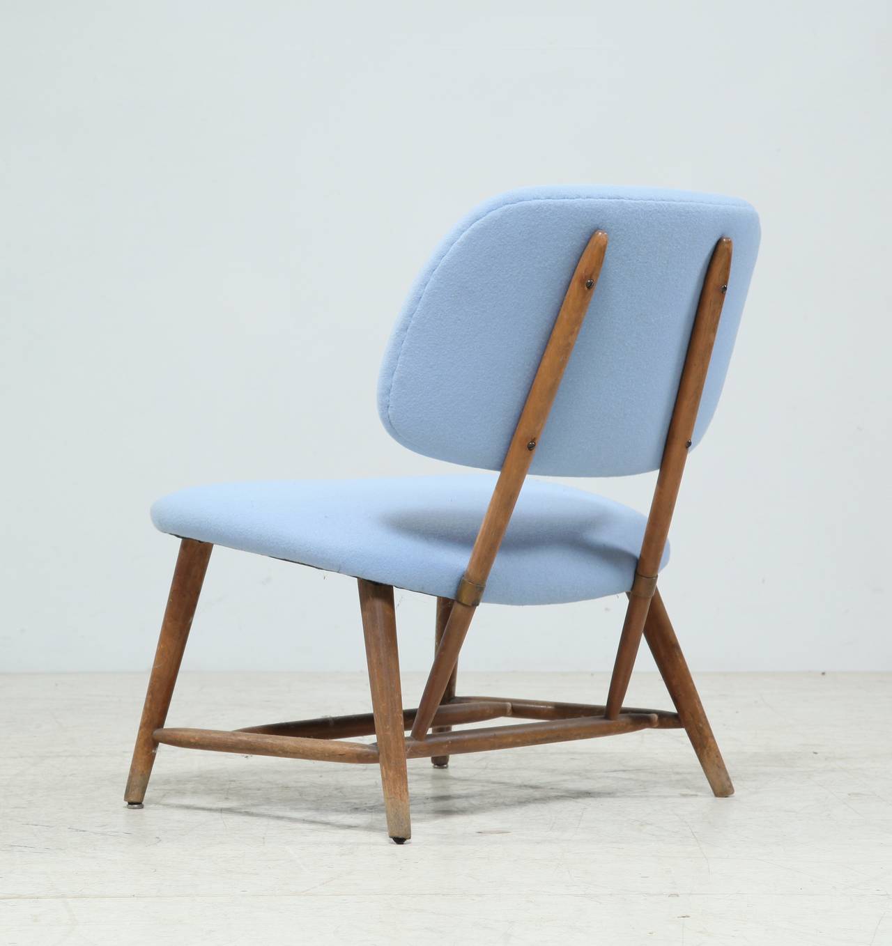 Light and transparent additional chair by Alf Svensson for Ljungs Industrier AB. At the time it was sold as a TV chair, due to its comfortable position.

Reupholstered with a powder blue Kvadrat fabric.