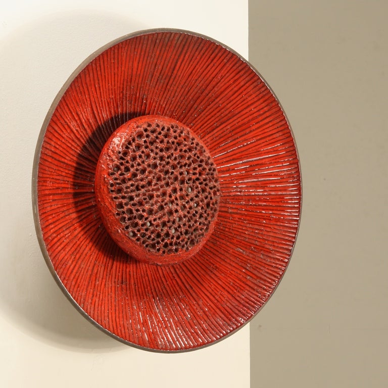 A ceramic wall lamp by Sejer, Denmark, 1960s in a perfect condition.

The openings in the heart of the flower give a wonderful light and make it a beautiful object.
Signed with makers mark.