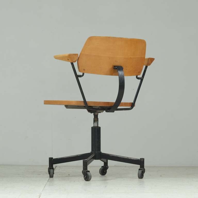 Wheeled desk chair with flexible back rest and carved out seat.
Strong and sturdy mid-century modern desk chair.