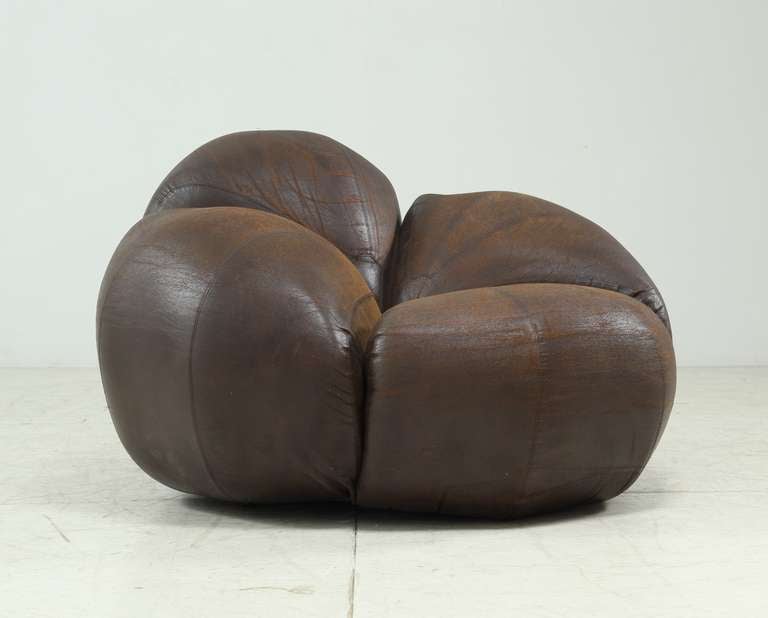 Marvellous low chair or pouf  by the Parisian artist Christian Adam.
This free-form petal shaped seating is designed in very small numbers.

The upholstery need replacement