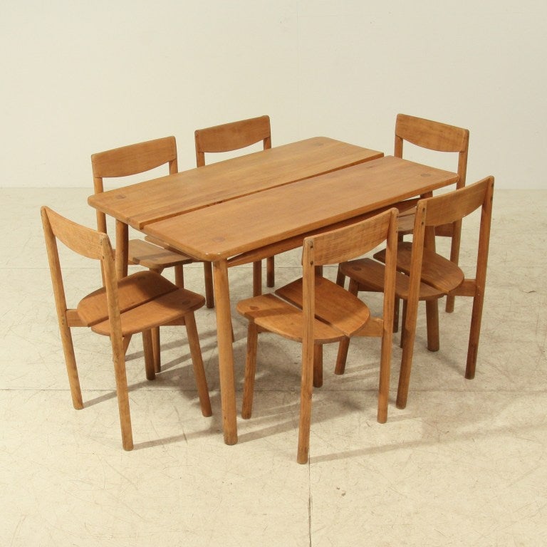 Dining suite with table and six chairs in campagne style by Pierre Gautier-Delaye, France, 1950s. 
Dimensions (hxwxd in cm)
chairs: 80 x 40 x 40; 44 seatheight
table: 73 x 120 x 79
Beautifully constructed and wonderful patina.
