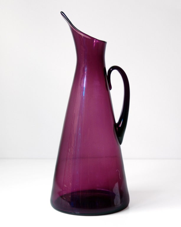 Massive sculptural conical pitcher with dramatic tapering spout, designed by Winslow Anderson in 1952. Design #976 in Amethyst, pictured in the 1952 catalog on page nine http://www.blenkoarchive.org/blenko_catalog_1952.htm

___

All our glass is