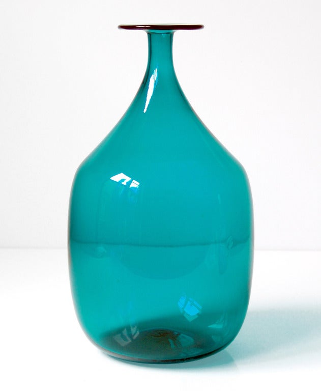 Large balloon-like ovoid bottle with narrow neck and widely flared flange top, designed by Joel Philip Myers in 1965, made for 1 year only.
Design #6515 in Peacock, pictured in the 1965 catalog.

___

All our glass is vintage mid-20thC hand
