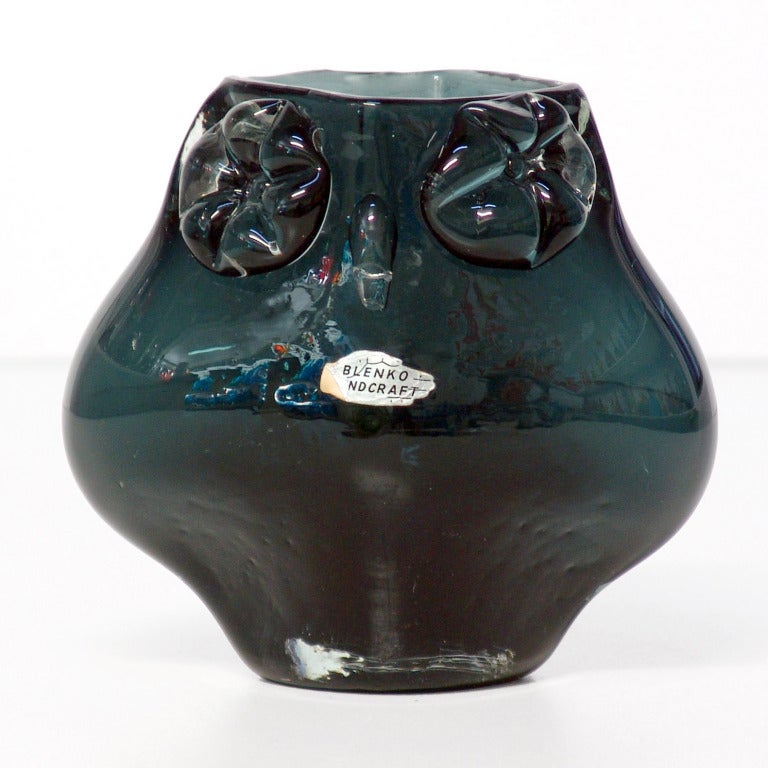 Rare and unusual small figural vase in the form of an owl with applied flower-like eyes and beak, designed by Wayne Husted in 1958, made for 1 year only.
Design #5830S in Charcoal, pictured in the 1958 catalog on page seven