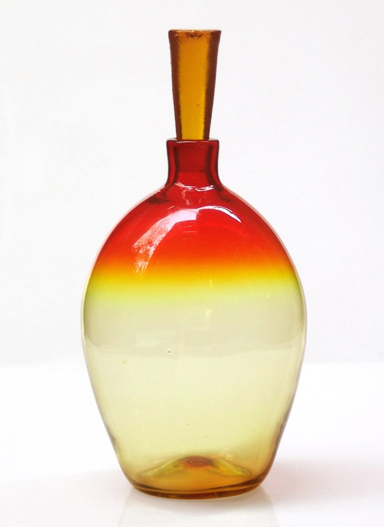 _____
(Items also available individually, please email to inquire.)

LEFT: ovoid decanter with tapered cylindrical wedge stopper, designed by Wayne Husted in 1962. Design #626M in Tangerine, pictured in the 1962 catalog. Measures 16.5 inches tall