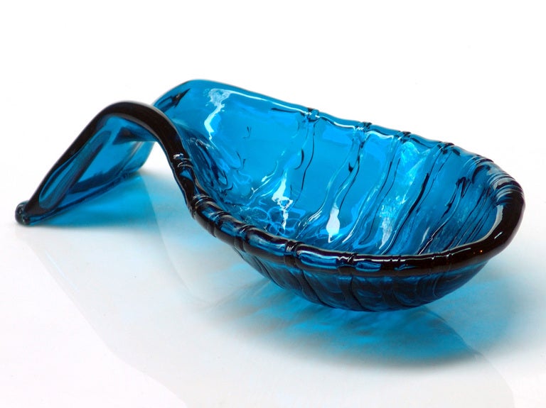 Coil wrapped abstract sculptural form bowl with extenuated parabolic arm, designed by Wayne Husted in 1954, made for 2 years only.
Design #5413 in Teal, pictured in the 1954 catalog on page one
