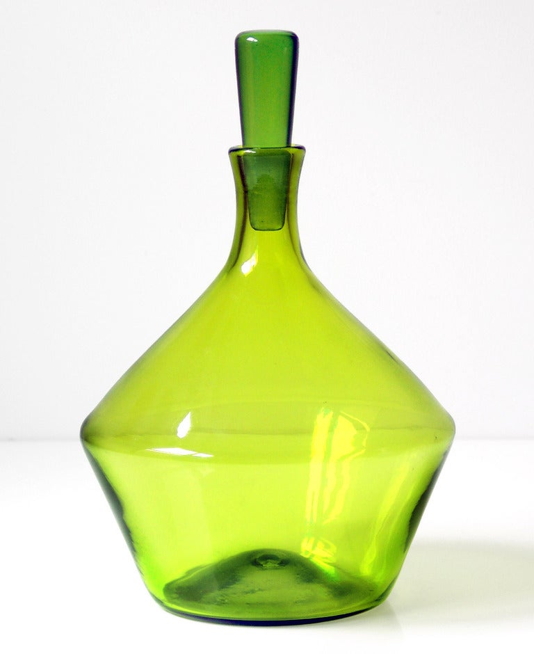 Geometric form decanter with wedge stopper, designed by Joel Philip Myers in 1964, made for 1 year only.
Design #6413 in Olive Green, pictured in the 1964 catalog.

___

All our glass is vintage mid-20thC hand blown art glass. Items are guaranteed