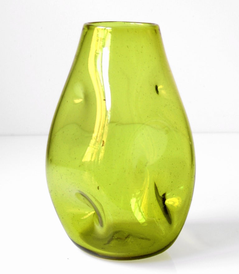 Dimpled or indented ovoid vase, designed by Winslow Anderson in 1950. Design #921M in Chartreuse, pictured in the 1950 catalog http://www.blenkoarchive.org/blenko_catalog_1950.htm

___

All our glass is vintage mid-20thC hand blown art glass. Items
