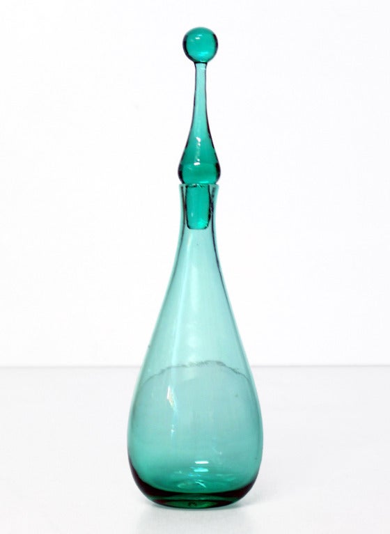 ______

(Items also available individually, please email to inquire.)

LEFT: medium size teardrop shaped decanter with ball tipped arrowhead stopper, designed by Wayne Husted in 1963, made for 2 years only.
Design #6311M in Sea Green, pictured