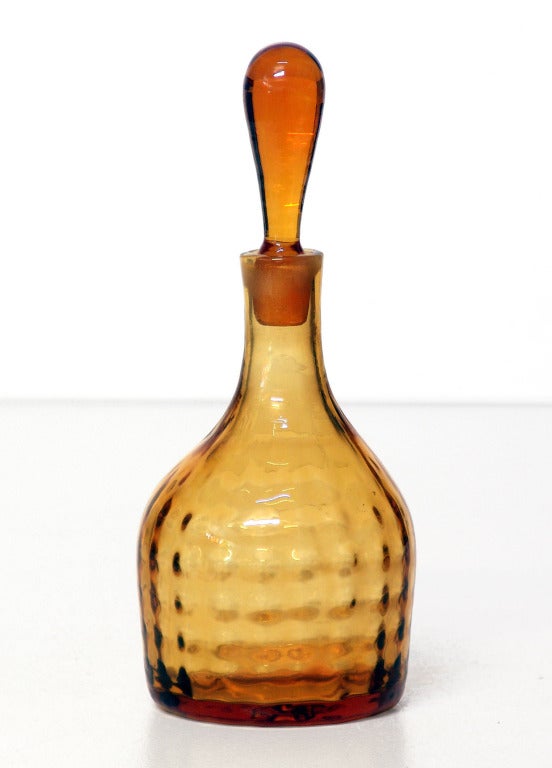______

(Items also available individually, please email to inquire.)

LEFT: optic dot pattern decanter with reverse teardrop stopper, designed by Joel Philip Myers in 1969.
Design #6912 in Wheat, pictured in the 1969 catalog.
Measures 9.75