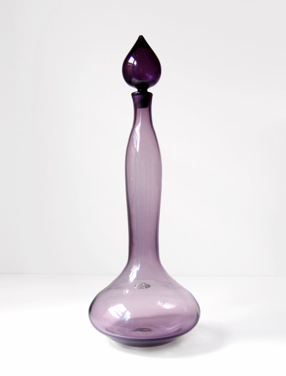 medium size genie decanter with reverse teardrop stopper, designed by Wayne Husted in 1958, made in this color for 2 years only.
Design #5815M in Lilac, pictured in the 1958 catalog on page eight