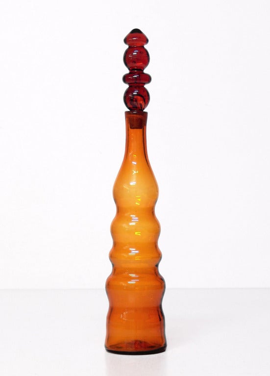 Tall and narrow elaborate baluster decanter, designed by Joel Philip Myers in 1967, made for 2 years only.
Design #6732S in Honey, pictured in the 1967 catalog.

___

All our glass is vintage mid-20thC hand blown art glass. Items are guaranteed