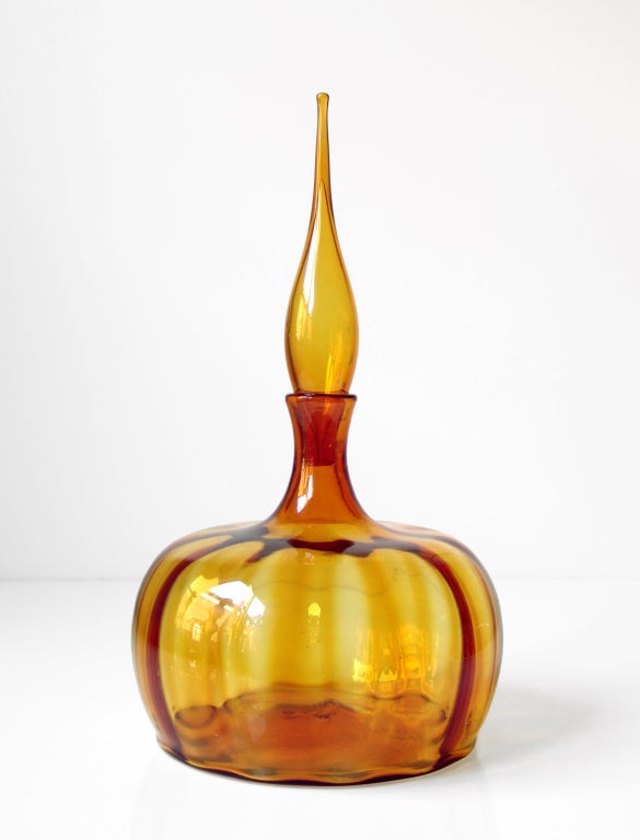 Large decanter with body in the form of a low, wide gourd or pumpkin, with large loose fitting flame stopper, designed by Joel Philip Myers in 1964, made for 2 years only. The dramatic optic rib technique on the body emphasizes the beautiful organic