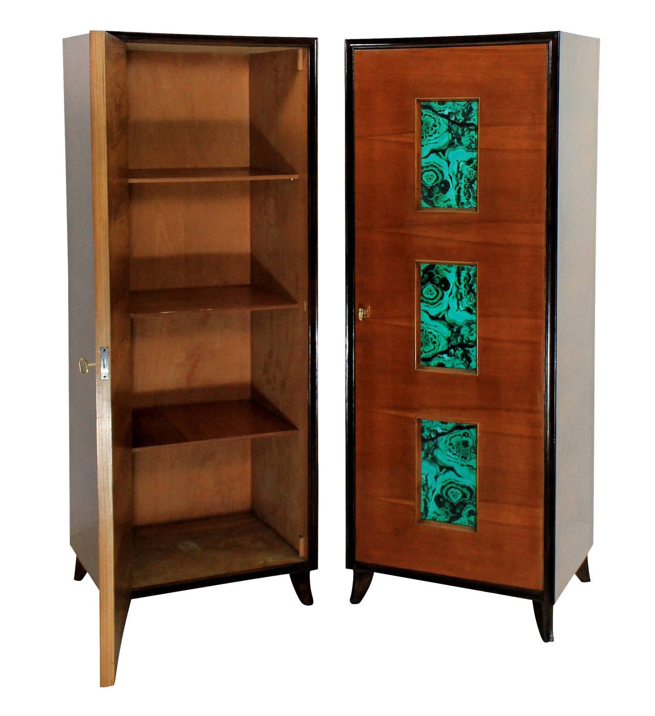 A pair of stylish Italian wardrobes in sapele wood of contrasting colours, with faux malachite glazed panels. On curved feet, with original keys, one cupboard contains shelves the other a hanger.