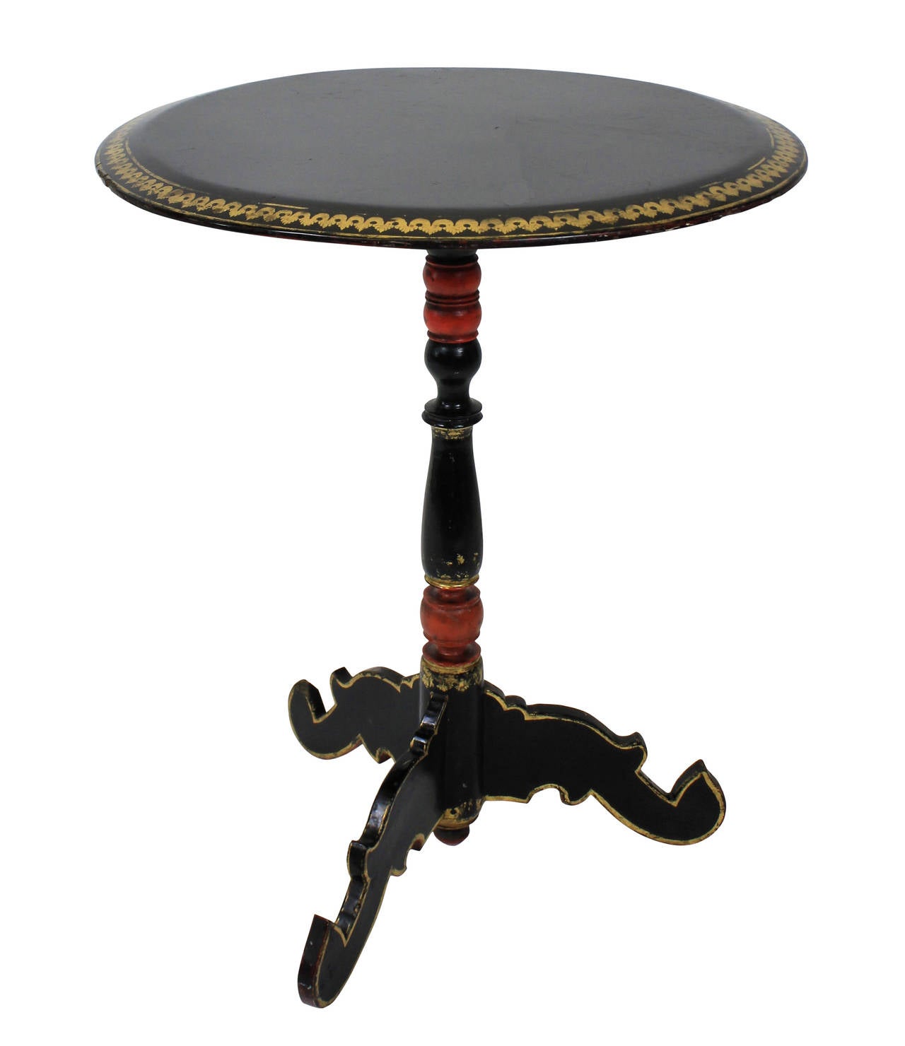 A Burmese lacquered, painted and gilded tripod table.