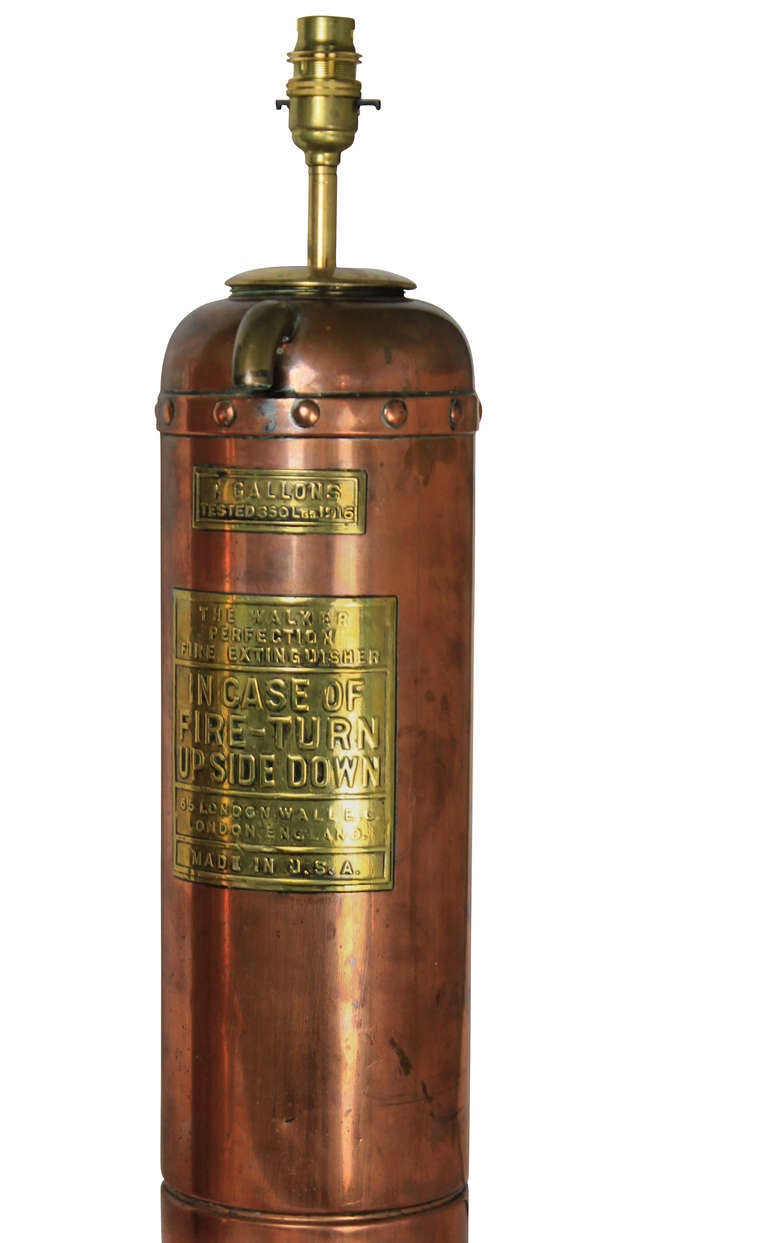 A pair of American 'Walker Perfection' copper fire extinguishers, now converted into lamps.