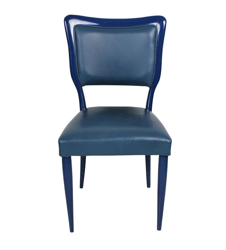 A set of eight Italian dining chairs in the style of Gio Ponti. These chairs were blue lacquered by the previous owner and are covered in pale blue leather.