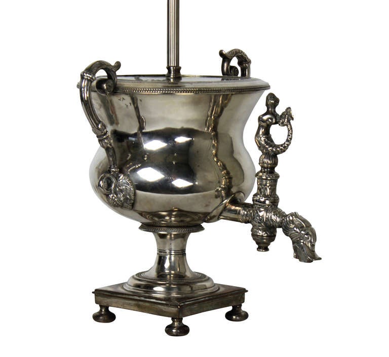 A Russian silver plated samovar of good quality and detail, depicting a mermaid and dolphin. It has been converted into a lamp.