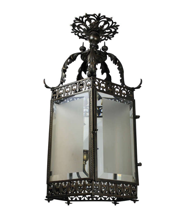 A fine English hexagonal hanging lantern in solid bronze with bevelled and etched glass panels, in the 