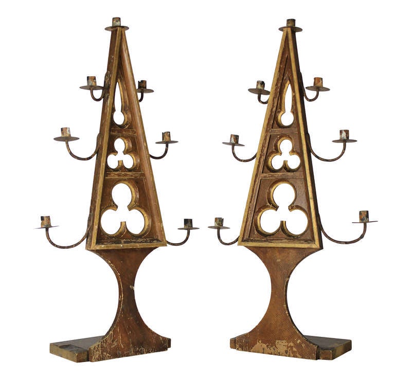 A pair of Flemish, carved pine and distressed painted pricket sticks in the Medieval Gothic manner.