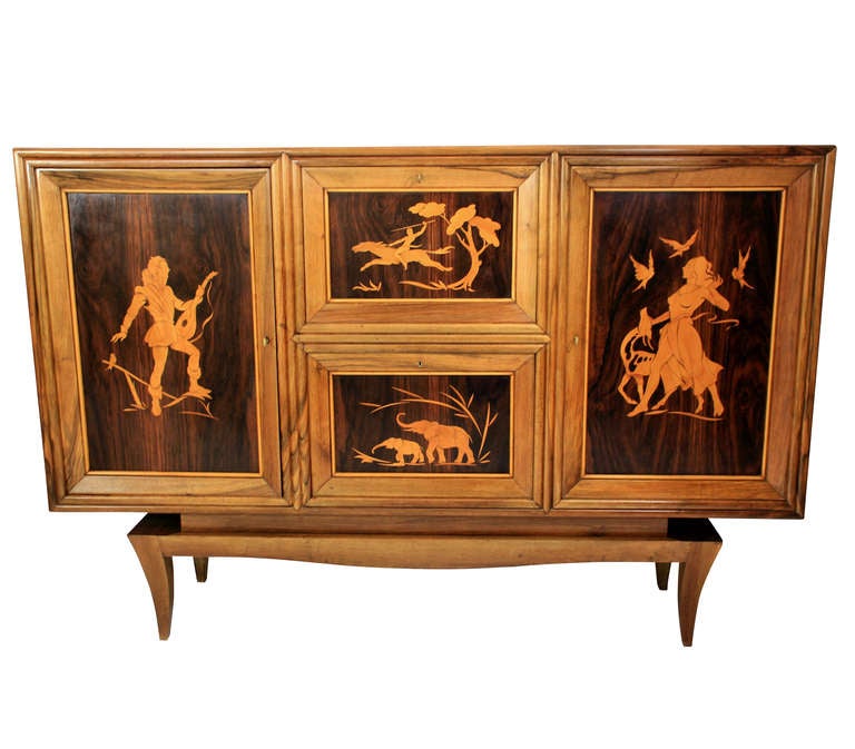 A large Italian cabinet of fine quality by the Laberinto group and is directly attributed to Colli. In solid walnut with rosewood panelling and marquetry in blond maple. The inside is oak lined. The cabinet on stand comprises two end cupboards, with