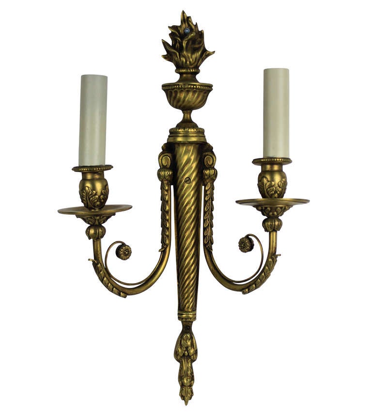 A set of six French twin branch, Neo-Classical wall lights in gilt brass.