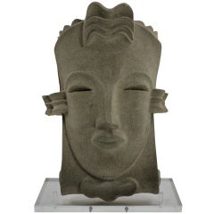 A Hollywood Regency Style Carved Stone Mask 