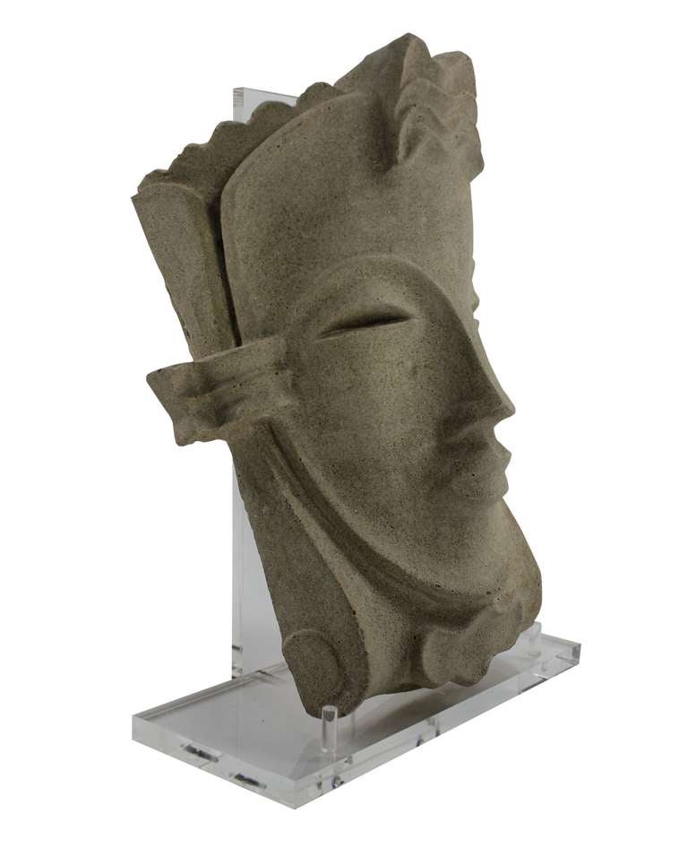 A Hollywood Regency Style Carved Stone Mask