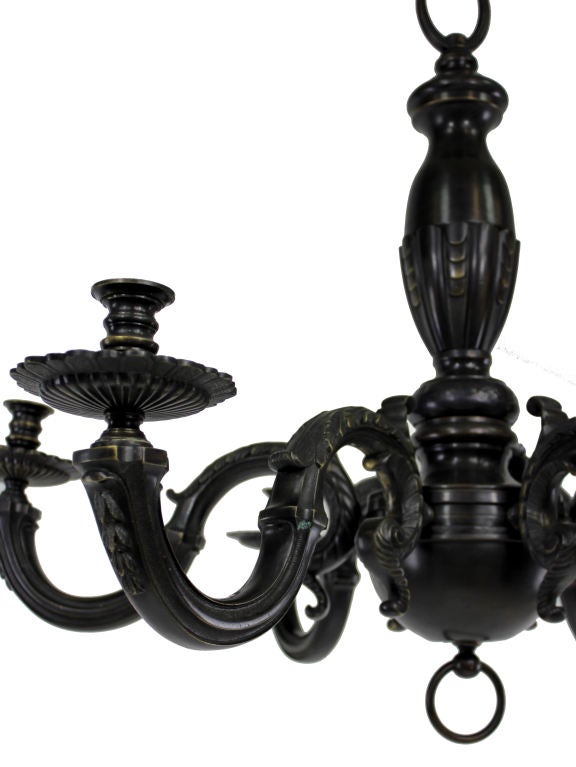 A large French Louis Philippe chandelier in bronze. Finely tooled with neo classical acanthus design.