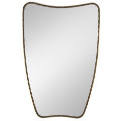 A 50's Italian Shield Shaped Mirror In Brass