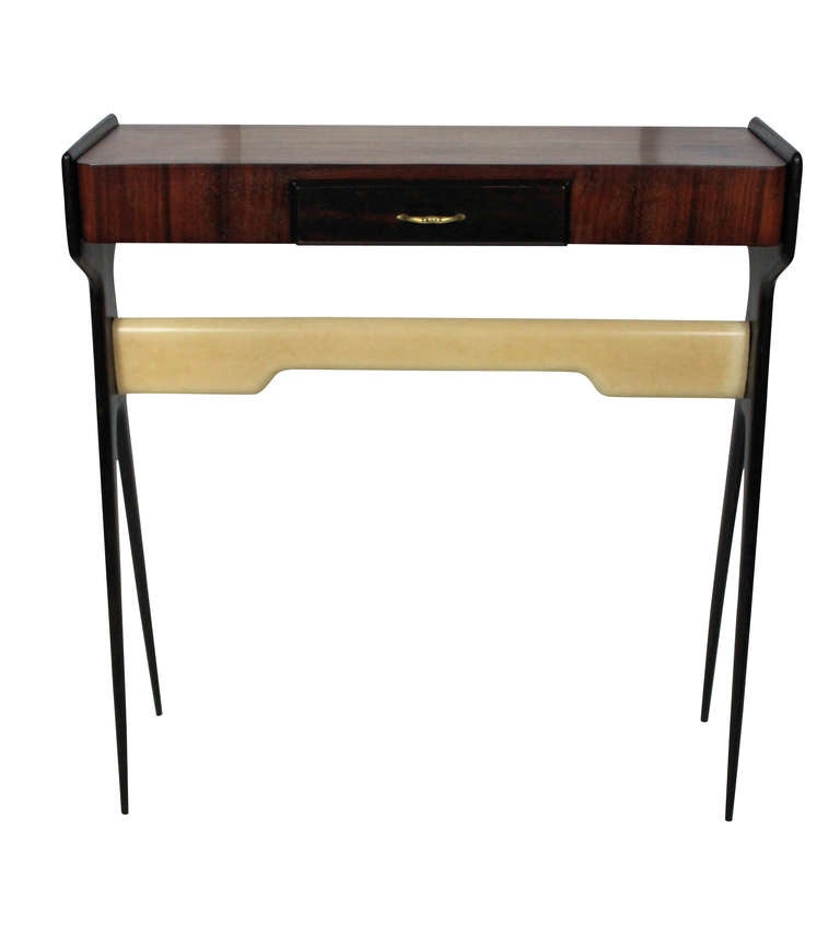 An Italian console table of stylish design. In rosewood with ebonised tapering legs and chrome detailing, with a single frieze drawer