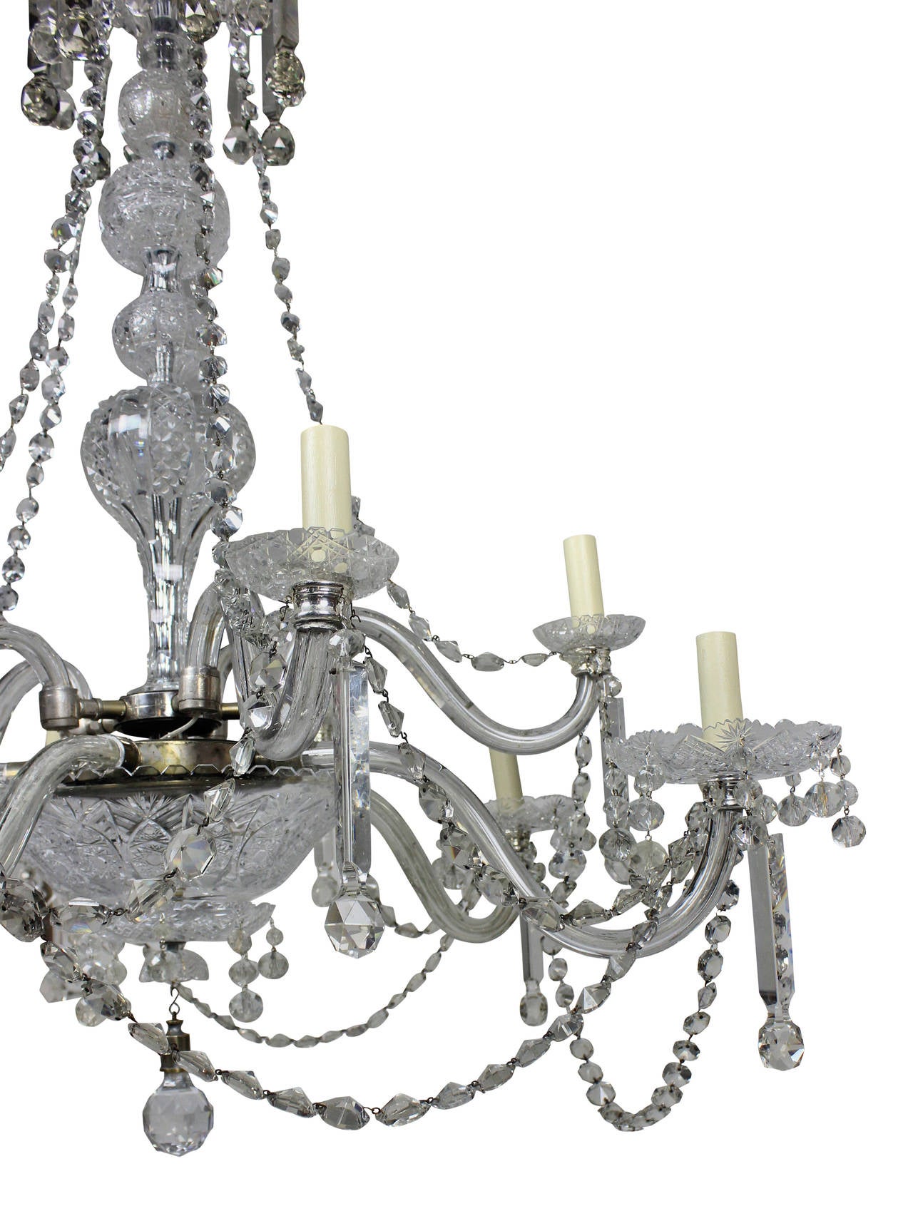 A large English cut-glass chandelier of good quality. Profusely hand cut throughout, hung with good quality prism drops, formerly a gasolier.