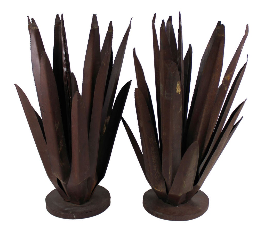 A pair of large French decorative metal cacti.