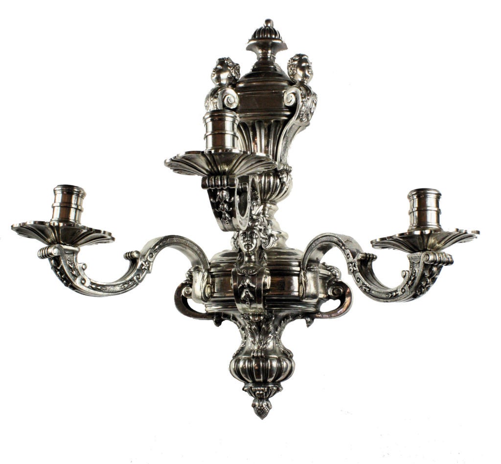 A pair of English silver plated bronze, three branch sconces after the model at Knowle, Kent. In the 17th Century style.