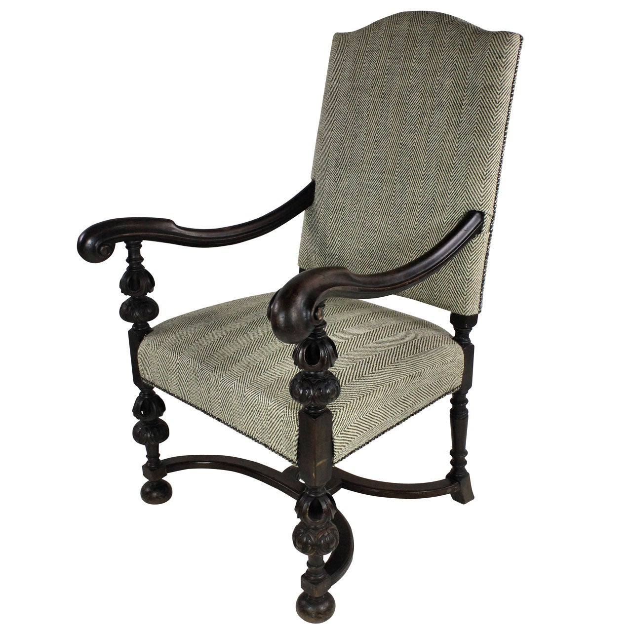 A French Carved Walnut Baronial Armchair