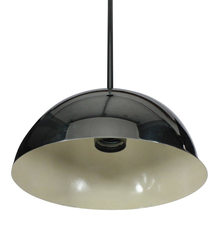 A pair of Italian Modernist hanging lights of linear design, in chrome with cream enamel interior.