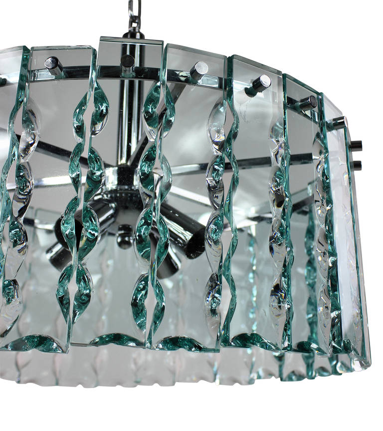 An Italian cut-glass corona chandelier of good quality, with a chromed fitting, hung throughout with hand-cut slabs of glass.