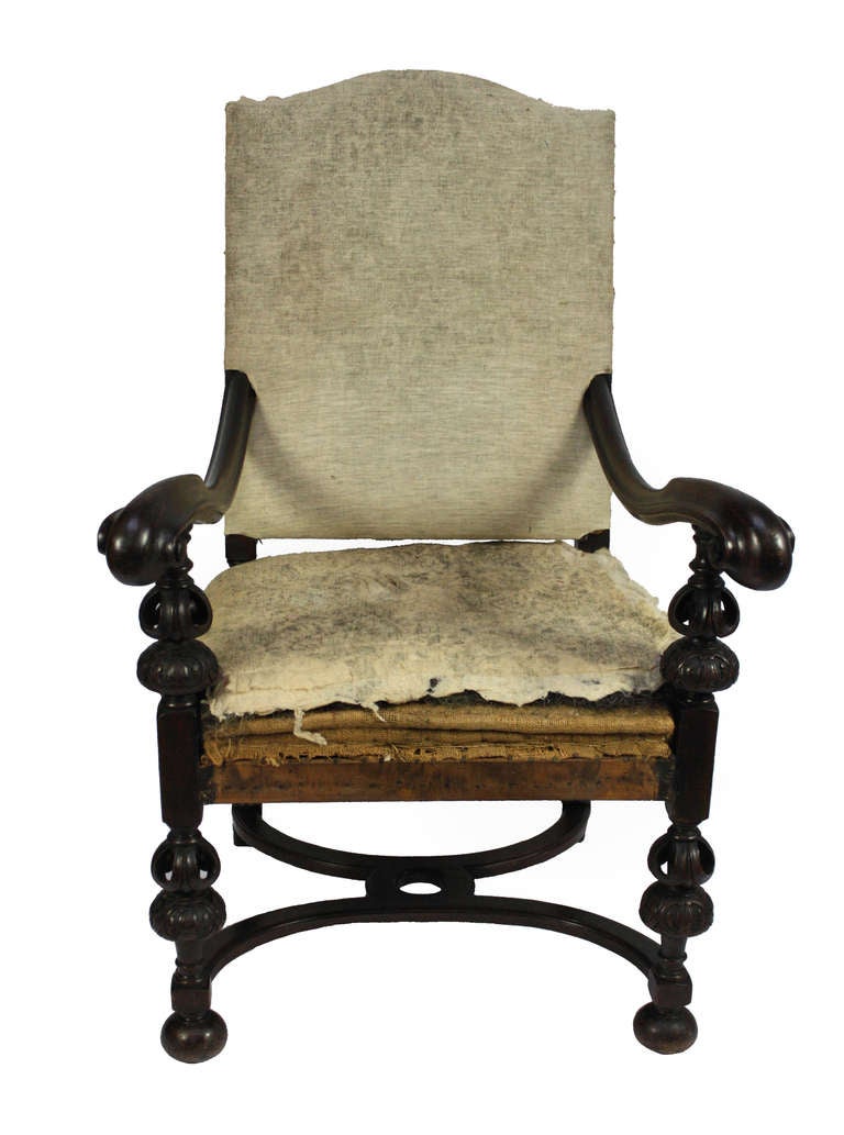 A French walnut armchair in the 17th Century style. Beautifully carved and ready to be upholstered.