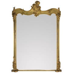 A Monumental English Rococo Revival Hand Carved & Water Gilded Mirror