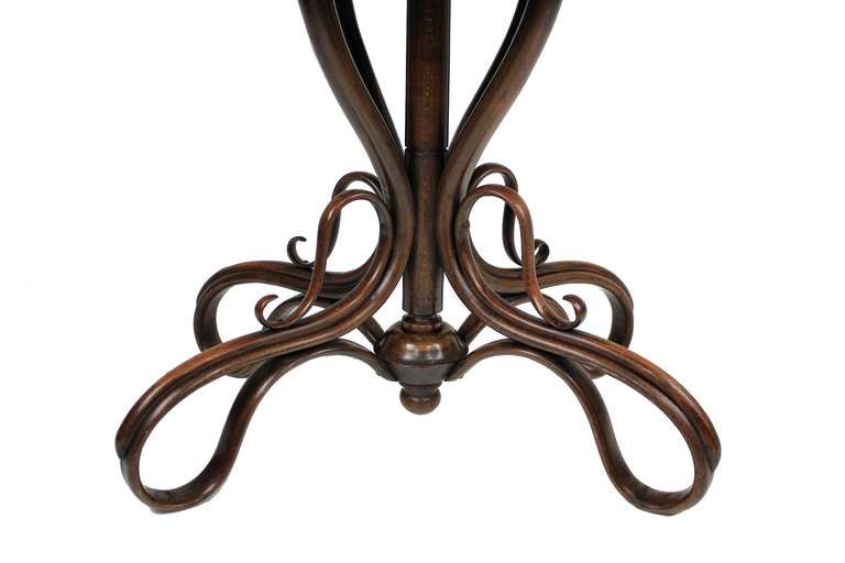 A rare Austrian bentwood pedestal table of organic form by J Kohn. ( Kohn later merged with Thonet). It has its original paper label and is signed.