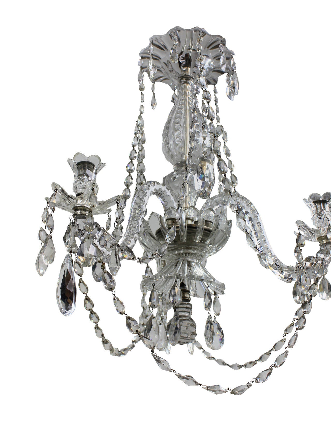 A French cut glass chandelier of smaller proportions by Baccarat of Paris. Suitable for lower ceilings, this chandelier is hung throughout with beautifully cut swags and pendants. This chandelier contains patented Baccarat Designs.