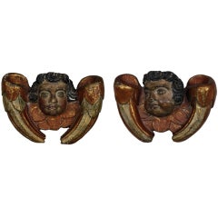 A Pair Of Spanish Carved Polychrome Cherubs