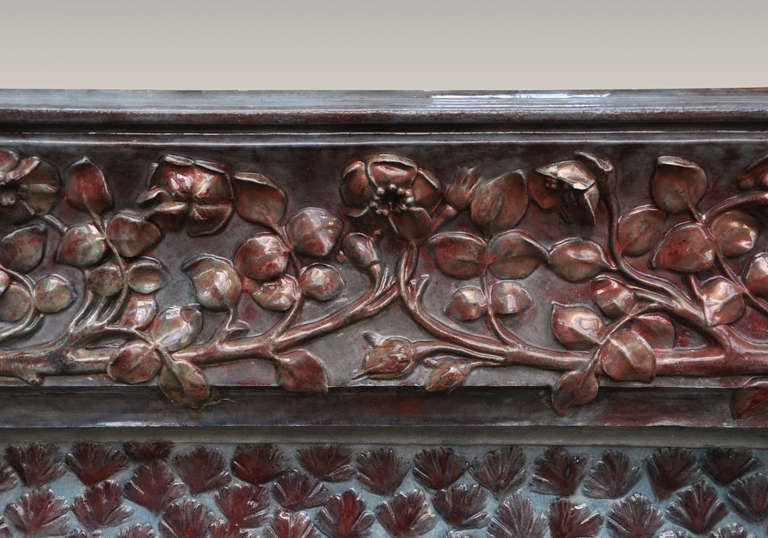 This beautiful and rare antique fireplace is signed by Emile Muller from the Grande Tuilerie in Ivry, close to Paris. The fireplace was realized in stoneware circa 1900.