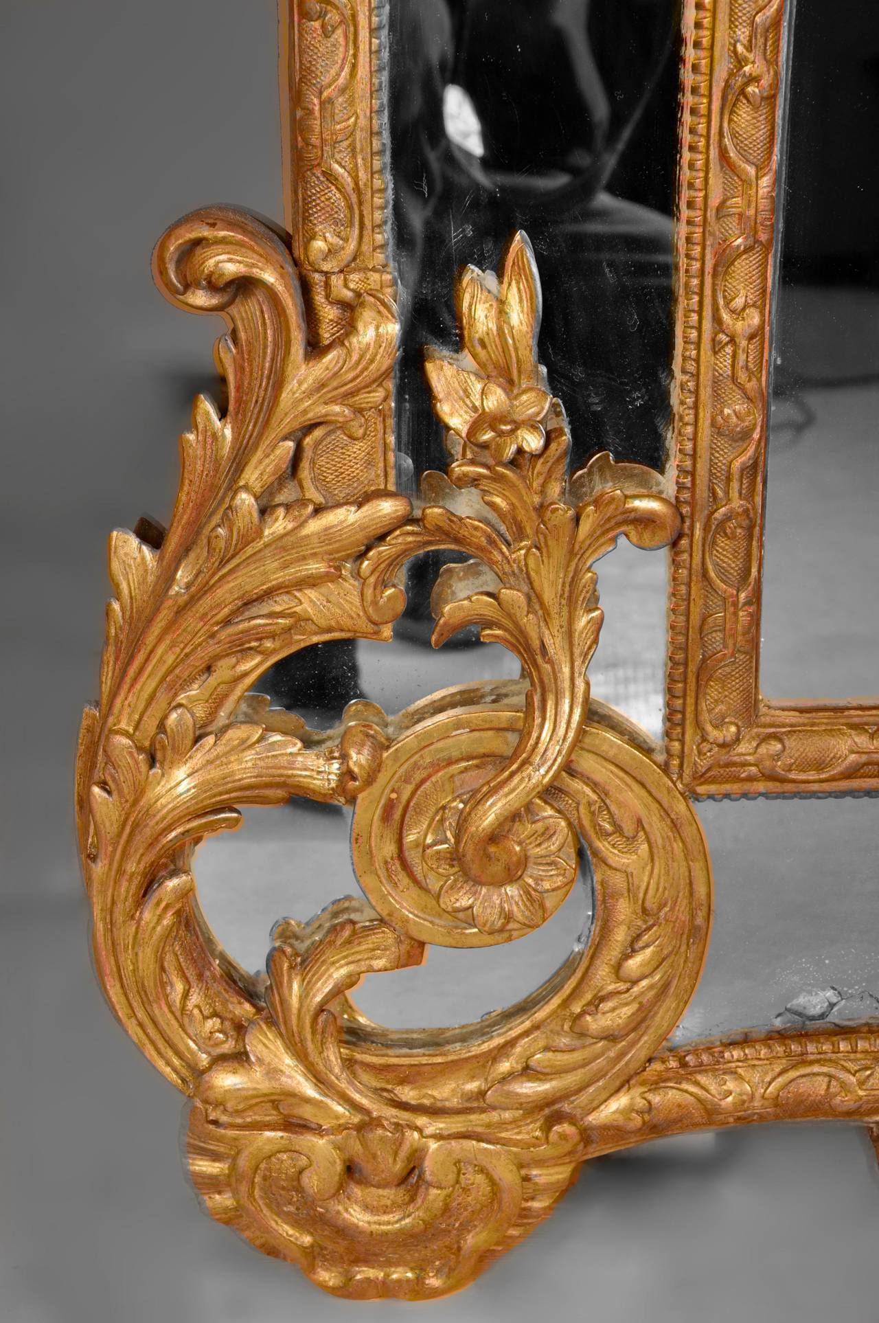 Carved Antique Regence Style mirror with Espagnolettes Decor, 19th Century For Sale