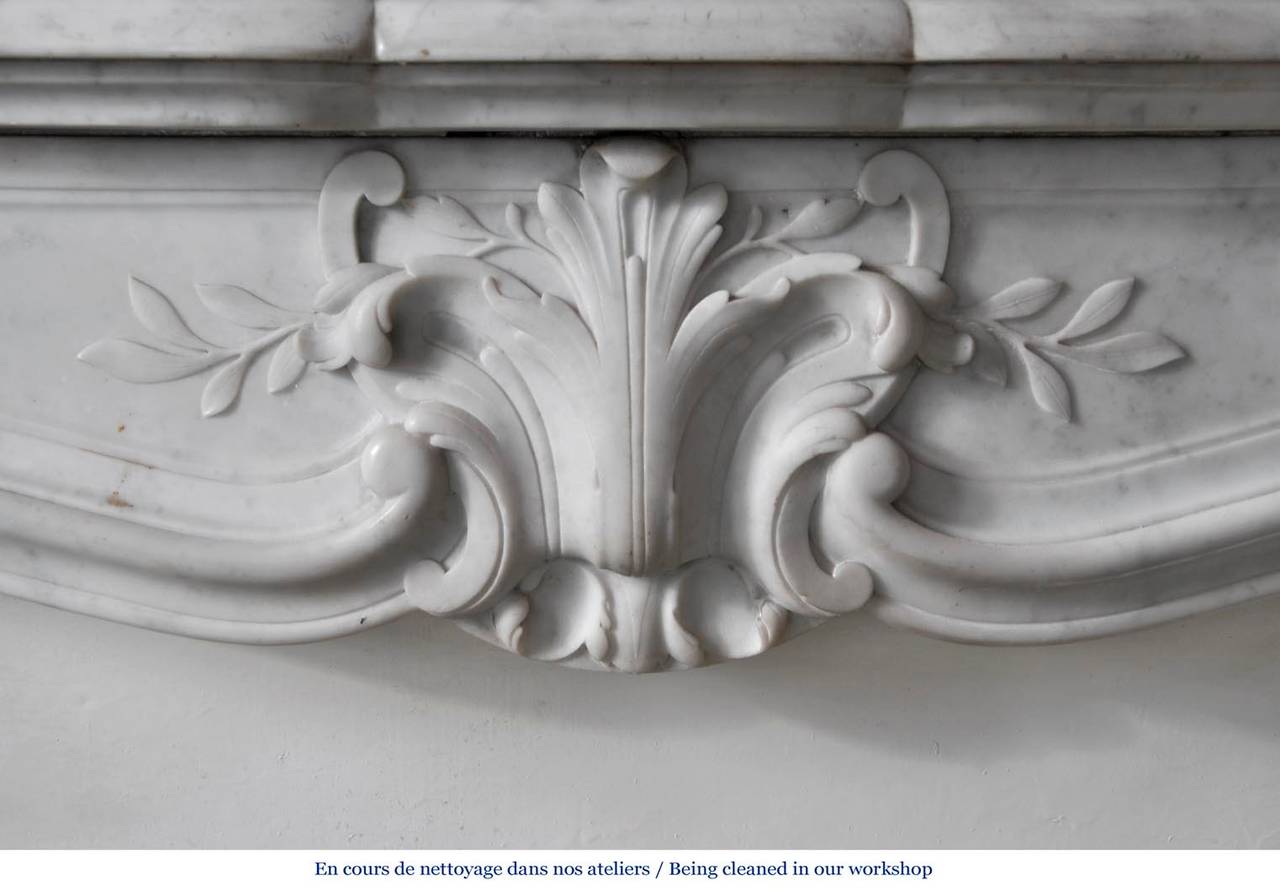 French Antique Louis XV style fireplace in white Carrara marble, Period 19th c.