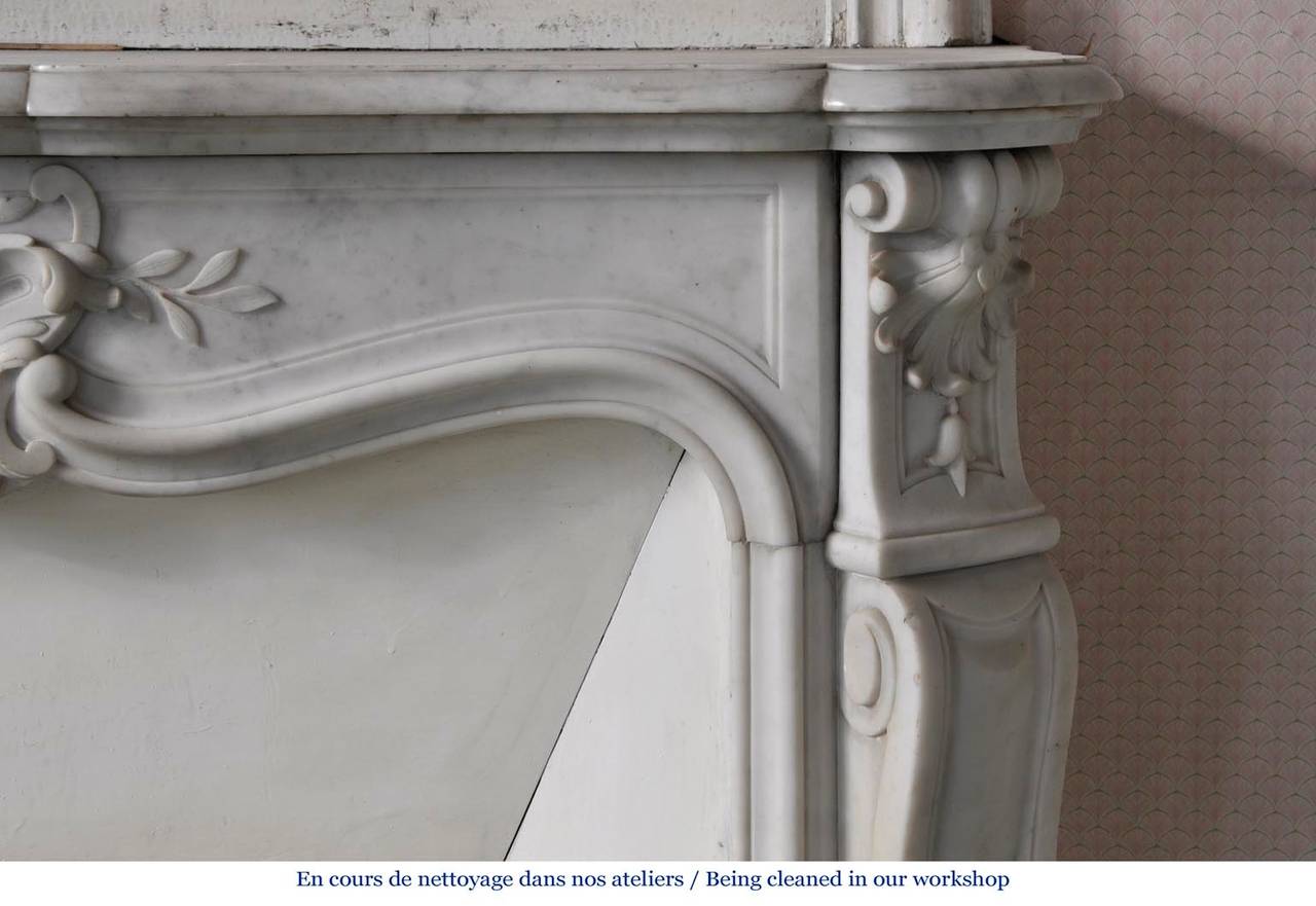 Carrara Marble Antique Louis XV style fireplace in white Carrara marble, Period 19th c.