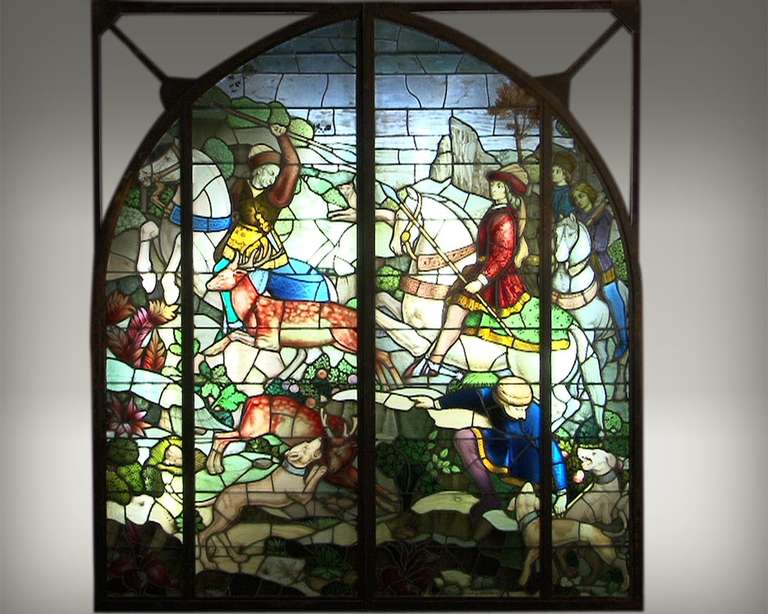 It represents a hunting scene with two squires mounted on horses. They are chasing deers, helping by hunt dogs. This Neo-Gothic stained glass window is highly colored. 
the Mauméjean was great stained glass manufacturers. The first workshop was